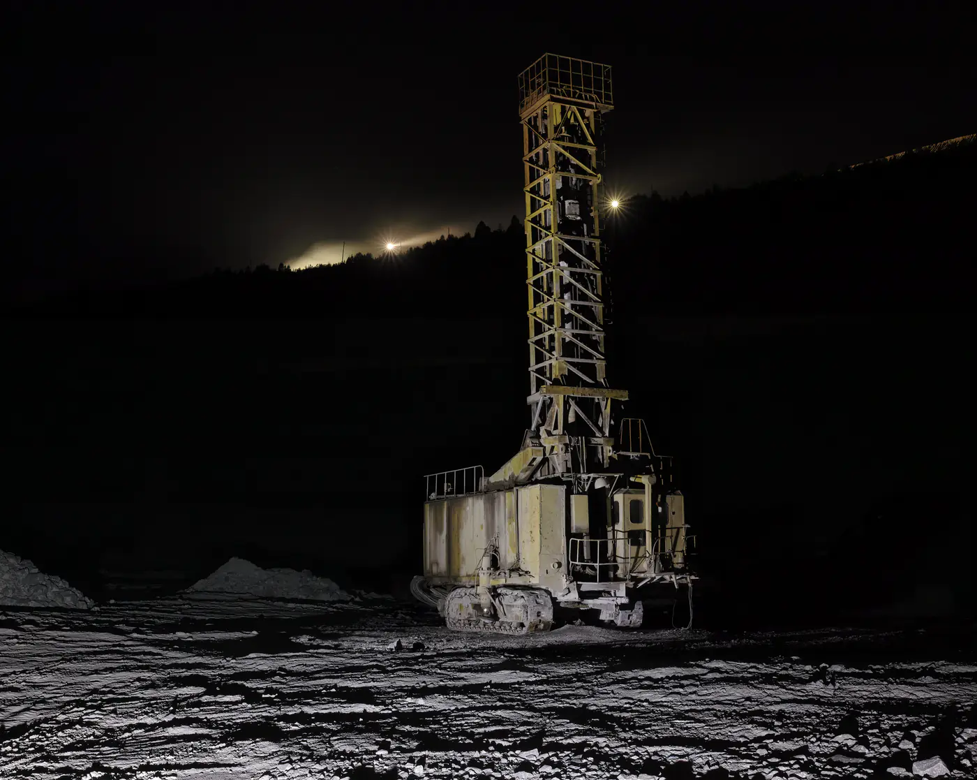 Drilling rig in a quarry at night